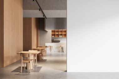 Ahşap masalar, sandalyeler, modern ışıklandırma ve poster, tasarım veya şablon konsepti için büyük boş beyaz bir duvar olan şık bir kafe. 3B Hazırlama