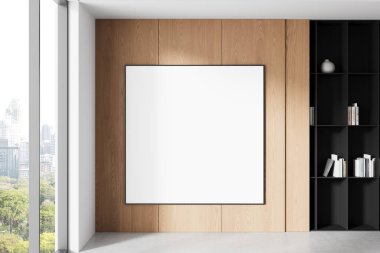 Modern iç mekanda ahşap duvar panelleri olan büyük boş poster modeli, açık raflar ve şehir penceresinin yanında, yaratıcı markalaşma için temiz bir düzen. 3B Hazırlama