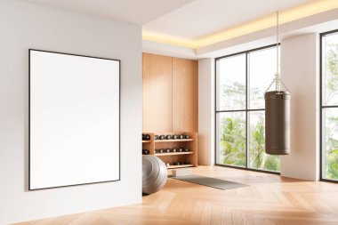 Ahşap zemin, spor aletleri, büyük pencereler ve doğa manzaralı temiz, parlak bir spor salonu içinde boş bir poster modeli. 3B Hazırlama