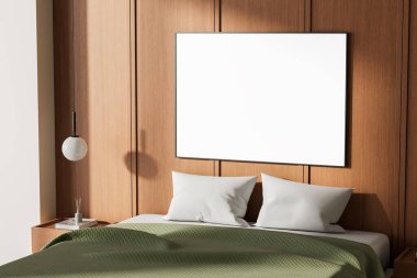 Yeşil battaniyeli ve beyaz yastıklı bir yatağın üzerinde boş poster modeli, modern ahşap duvar arka planı, temiz iç tasarım, 3D görüntüleme