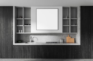 Minimalist mutfak içi. Beton bir duvarda boş poster modeli var. Etrafı koyu ahşap dolaplar ve raflarla çevrili.