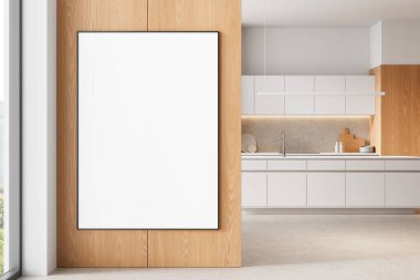 Modern mutfak iç dekorasyonunda ahşap duvara asılı boş dikey poster, temiz beyaz tasarım, beton arka plan. 3B Hazırlama