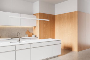 Beyaz minimalist dolapları, ahşap panel duvarları, taş kaplama, beton zeminde kabin altı aydınlatması olan gösterişli modern mutfak. 3B Hazırlama