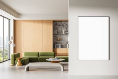 Modern iç mekanda beyaz duvara boş poster modeli, yeşil kanepe, ahşap paneller, ve kitaplık, minimalist reklamcılık veya sanat tasarımı konsepti. 3B Hazırlama
