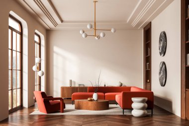 Sıcak ahşap zemin ve bej duvarlarda kırmızı kanepe, koltuk, ahşap ve seramik dekor, geometrik avize, rahat modern iç döşeme. 3B Hazırlama