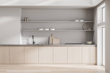 Modern mutfak içi hafif ahşap dolaplar, beton tezgah ve doğal ışık altında nötr tonlarda açık raflar. 3B Hazırlama