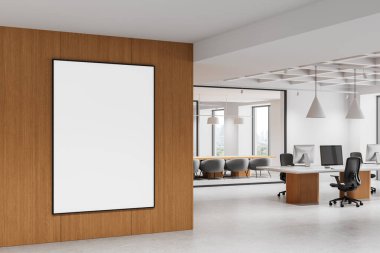 Temiz tasarım, beyaz duvarlar ve açık çalışma alanı düzeniyle modern ofis içinde ahşap duvarda boş çerçeveli poster modeli. 3B Hazırlama