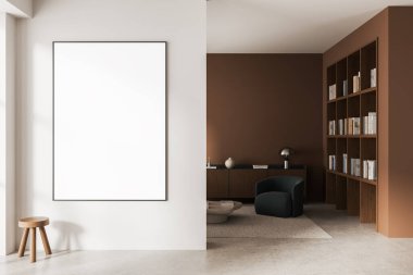 Boş çerçeveli poster modeli, kitaplıkları, modern mobilyaları ve minimalist iç konsepti olan rahat bir okuma alanının yanındaki temiz beyaz duvara asıldı. 3B Hazırlama