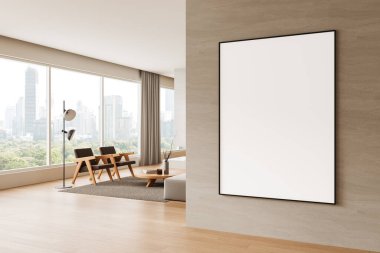 Modern iç dekorasyonda bej duvarda boş dikey poster modeli var. Ahşap zemin, büyük pencereler ve en az mobilya. 3B Hazırlama