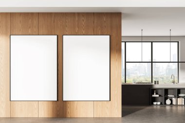 Modern mutfak içerisindeki ahşap duvarda iki boş çerçeveli poster, büyük pencereli, minimalist tasarım ve şehir manzaralı konsept. 3B Hazırlama