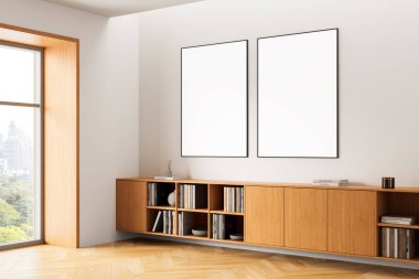 Ahşap dolabın üstündeki duvarda iki boş poster çerçevesi, modern iç tasarım tarzı, ahşap zemin ve beyaz zemin, sunum konsepti. 3B Hazırlama