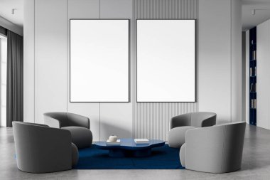 Beyaz duvardaki iki boş poster çerçevesi, temiz iç mekanda, gri koltuklar ve mavi masa ile çevrili, 3D görüntüleme, poster modeli konsepti
