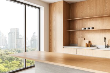 Hafif ahşap dolaplar, minimalist stil ve şehrin ufuk çizgisini ve yeşilliği gözler önüne seren geniş pencereli modern mutfak. 3B Hazırlama