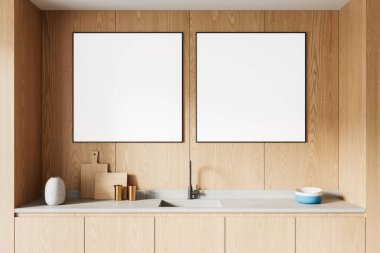 Lavabo ve tezgahın üstündeki ahşap duvarda iki boş poster çerçevesi olan minimalist mutfak iç mimarisi. Model sunumu için temiz tasarım konsepti. 3B Hazırlama