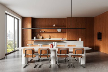 Ahşap kaplama, minimalist mobilyalar ve tarafsız arka planda geniş pencerelerden şehir manzarası olan çağdaş mutfak iç mimarisi. 3B Hazırlama