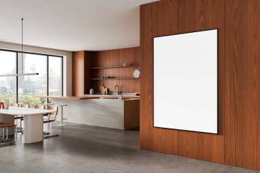 Ahşap bir duvarda büyük, boş, dikey bir posteri olan parlak, modern bir mutfak, temiz bir düzen, beton zemin, şehir manzarası. 3B Hazırlama