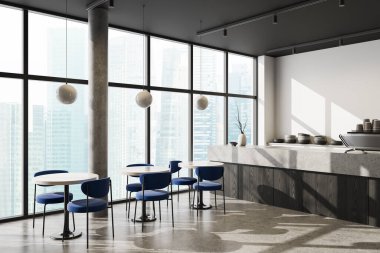 Contemporary coffee shop interior featuring blue chairs, round tables, concrete surfaces, large windows and city skyline view in daylight. 3D Rendering