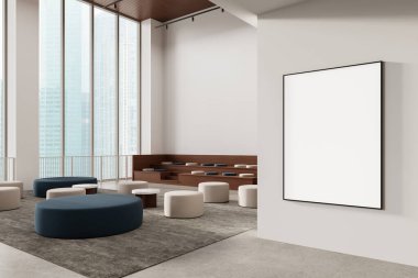 Spacious modern lounge interior with blank vertical poster mockup on wall, tiered wooden seating, large windows, and neutral-toned furniture. 3D Rendering