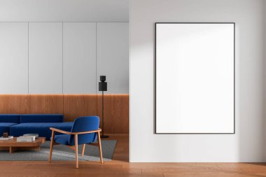 Vertical poster mockup on white wall in a modern living room interior with wooden floor, blue chair, and paneling, concept of design presentation. 3D Rendering