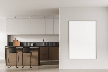 Stylish modern kitchen with two stools, brown cabinetry, and blank vertical poster frame on light wall, 3D Rendering, minimal design concept mockup
