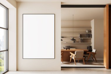 Contemporary interior showing large vertical poster mockup on beige wall beside modern office with wooden furniture and shelves, 3D Rendering