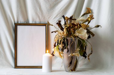 Photo frame mockup with dried dry flowers in a vase, still life on a light background