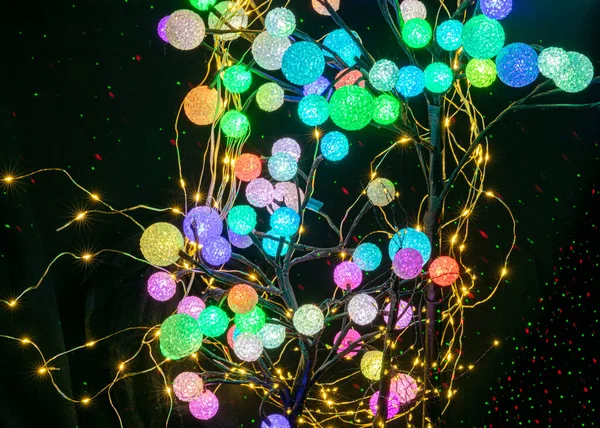 abstract light pattern, balls of different shapes and colors, long exposure night photo, neon glow, blurred background with colored circles