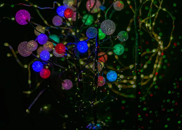 abstract light pattern, balls of different shapes and colors, long exposure night photo, neon glow, blurred background with colored circles