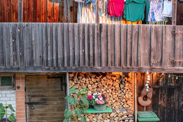 stock image landscape with wooden shed, garden shed, clothes drying outside, summer