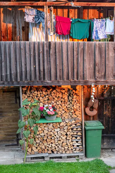 stock image landscape with wooden shed, garden shed, clothes drying outside, summer