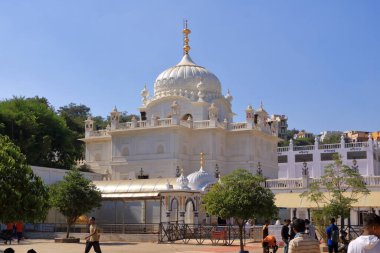 December 18 2022 - Bidar, Karnataka in India: People enjoy the area around the Guru Nanak Jhira Sahib gurudwara temple