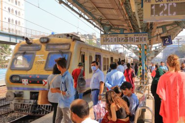 December 21 2022 - Mumbai, Maharashtra in India: Commuters using the local trains in Mumbai city