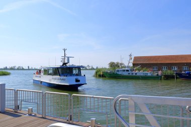 August 14 2022 - Karnin, Usedom in Germany: tranquil hustle and bustle in the harbour