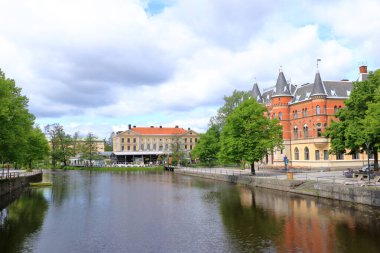 June 01 2022 - Orebro in Sweden: Facades of historical buildings near the castle by the river