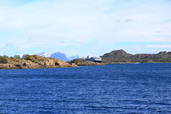 stock image May 29 2022 - Svolvaer, Lofoten, Norway: the Havila Kystruten cruise liner Havila Castor sails through the fjord