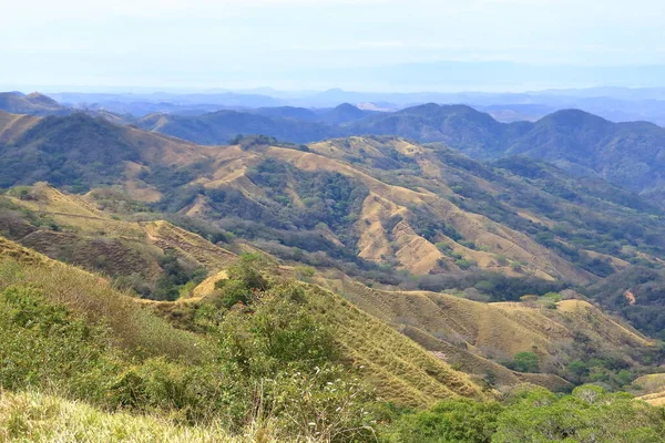 stock image a beautiful scenery from the road between Monteverde and Limonal, view over the mountains to the Sea in Costa Rica