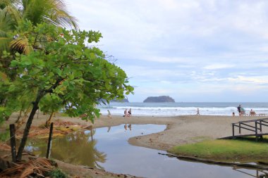 March 14 2023 - Samara, Guanacaste in Costa Rica: People enjoying the beach in Costa Rica clipart