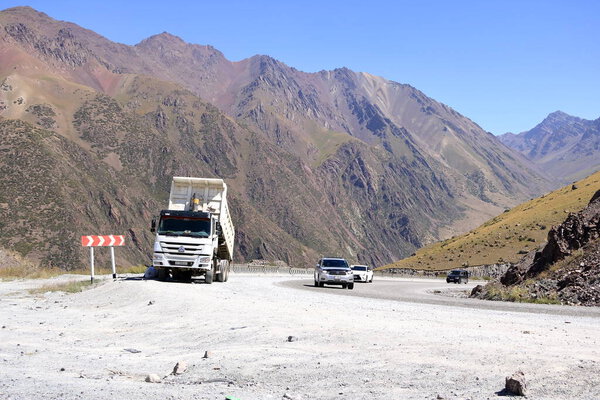 August 20 2023 - Too-Ashuu pass near Bishkek in Kyrgyzstan, Central Asia: people and cars cross the pass