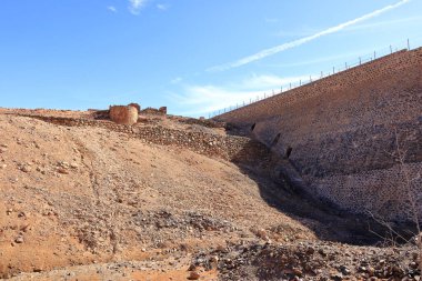 Embalse de los Molinos, Fuerteventura, Canary Islands: dam wall of the old reservoir clipart