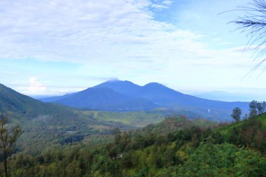 Stunning panoramic view of the Ijen Volcano Complex with mountains, East Java in Indonesia clipart