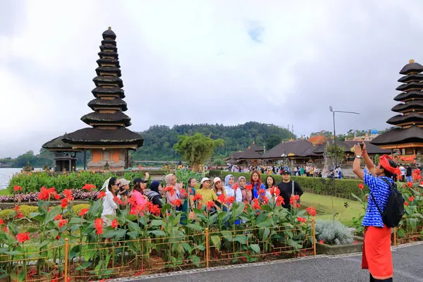stock image Bali in Indonesia - February 02 2024: people visit the Pura Ulun Danu Beratan Bratan temple