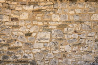 Doğal sarı taş bir duvar.