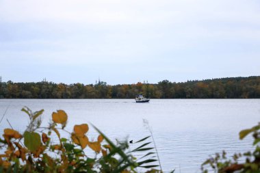 Havel river with boat near Potsdam in autumn, Germany clipart