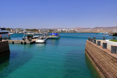 Aqaba in Jordan - May 17 2024: boats in the harbor of Aqaba clipart