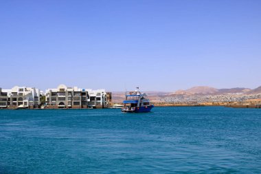 Aqaba in Jordan - May 17 2024: boats in the harbor of Aqaba clipart