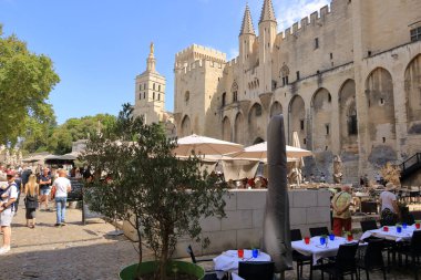 Avignon, France in Europe - August 25 2024: Tourists gather in front of the Pope's Palace clipart