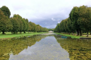 Tanlay, France in Europe - September 05 2024: people enjoy the majestic french castle and park clipart