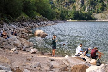 Lac Blanc, Colmar, France - September 07 2024: people enjoy the day at the white lake in the Vosges clipart