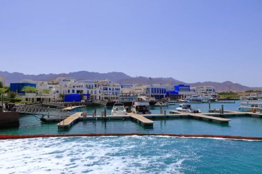 Aqaba in Jordan - May 17 2024: boats in the harbor of Aqaba clipart