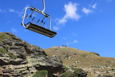 Ordino Arcalis, Mirador Solar de Tristaina in Andorra - August 30 2024: people use the chairlift to the mountain peak clipart